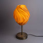 Sozori unique wave pattern desk lamp with a warm orange glow and modern base design