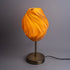 Sozori unique wave pattern desk lamp with a warm orange glow and modern base design