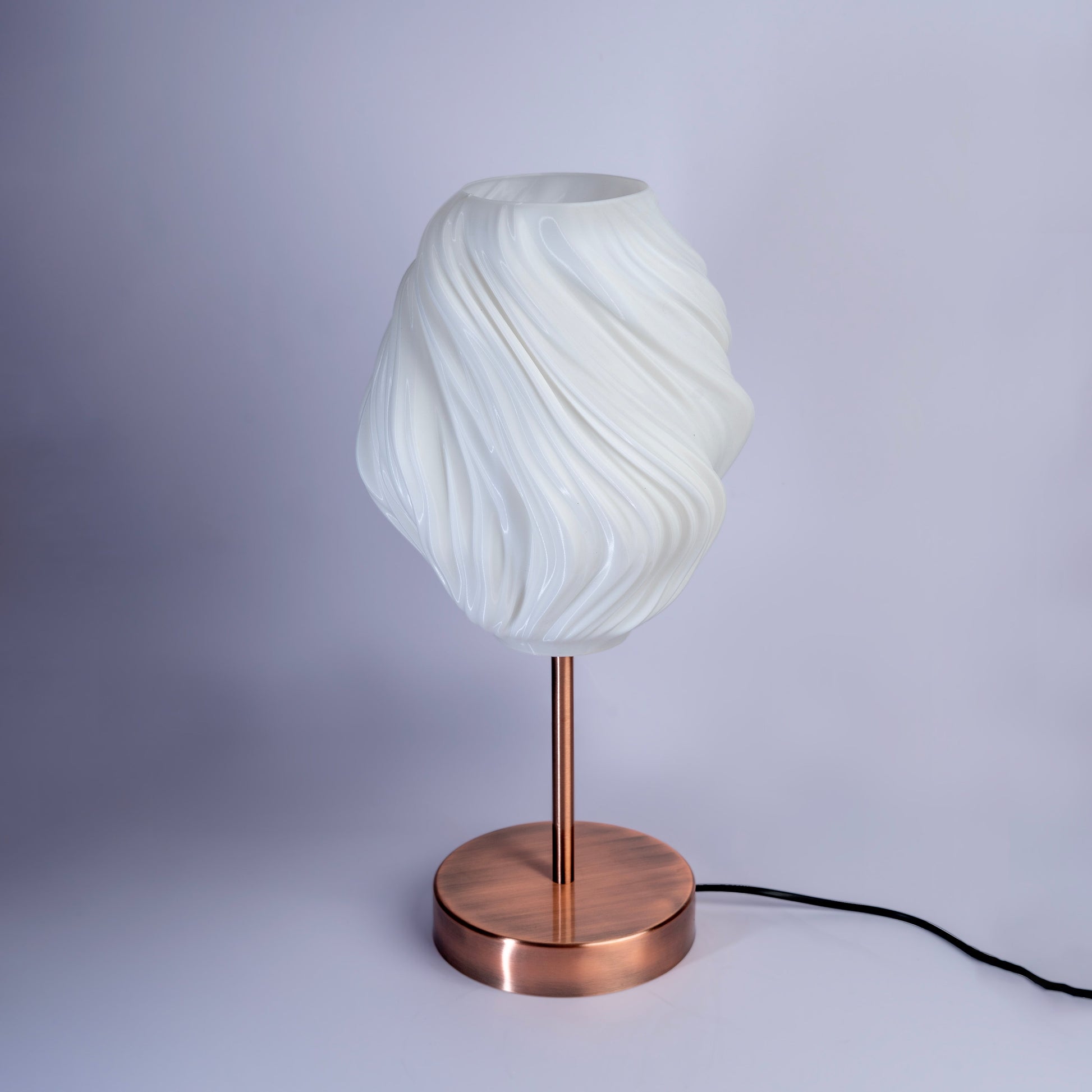 Sozori unique wave pattern desk lamp with a sleek copper base and an elegant white shade