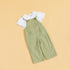 Unisex green dungarees for kids made from soft fabric with button details and pocket