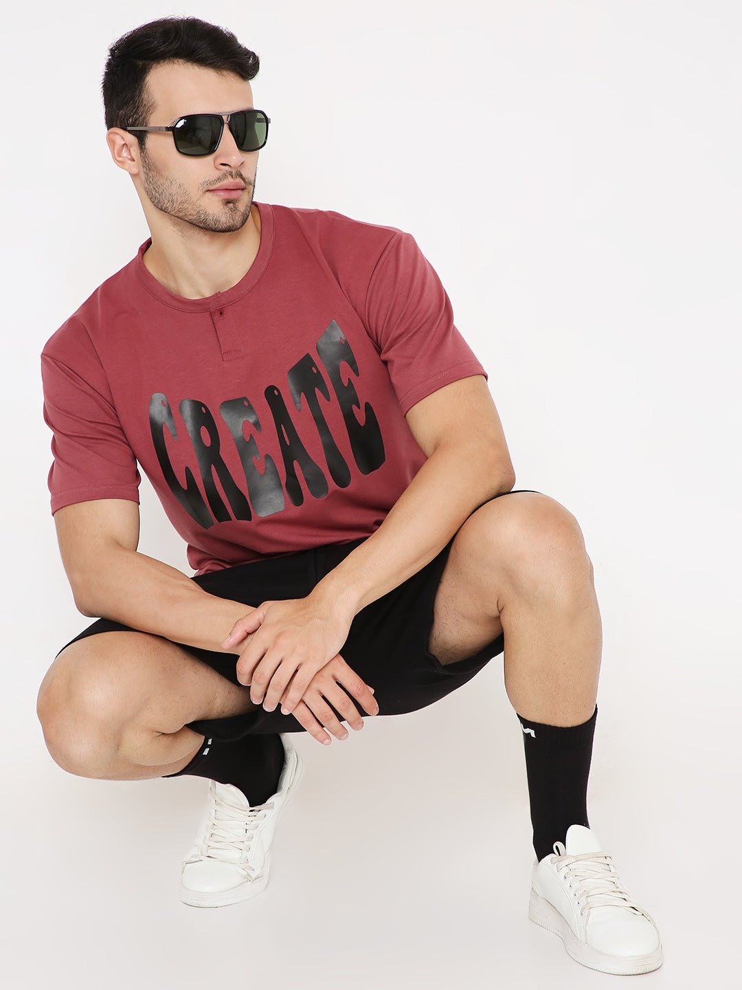 Stylera oversized onion red t-shirt with CREATE graphic on male model wearing sunglasses