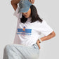 Stylera good vibes only graphic tee for women worn with denim jeans and a blue cap