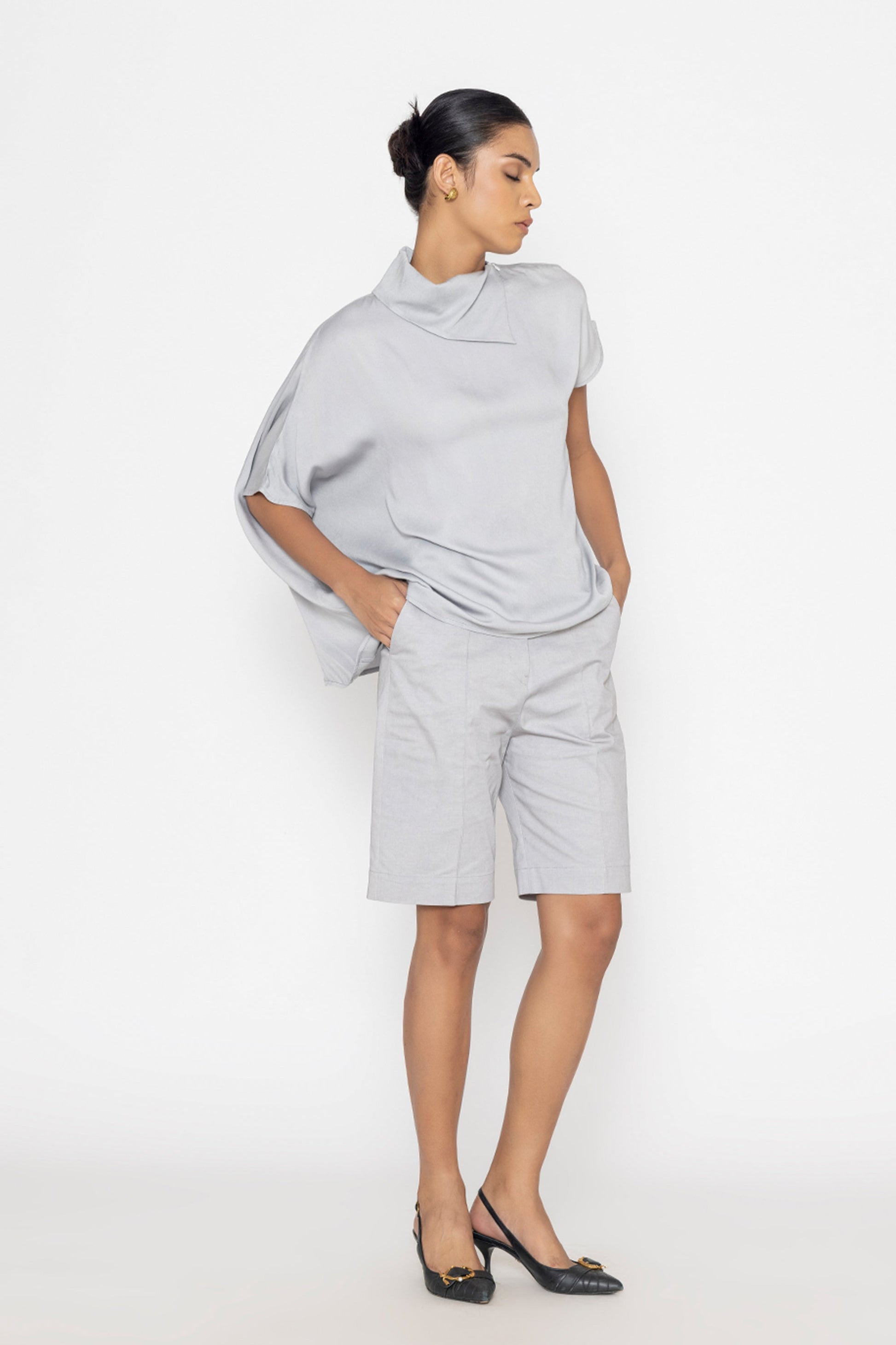 Stylera light gray statement top with asymmetric design paired with matching shorts
