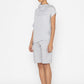 Stylera light gray statement top with short sleeves and asymmetrical collar worn with matching shorts