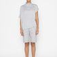 Stylera light gray statement top with high neck and short sleeves styled with matching shorts