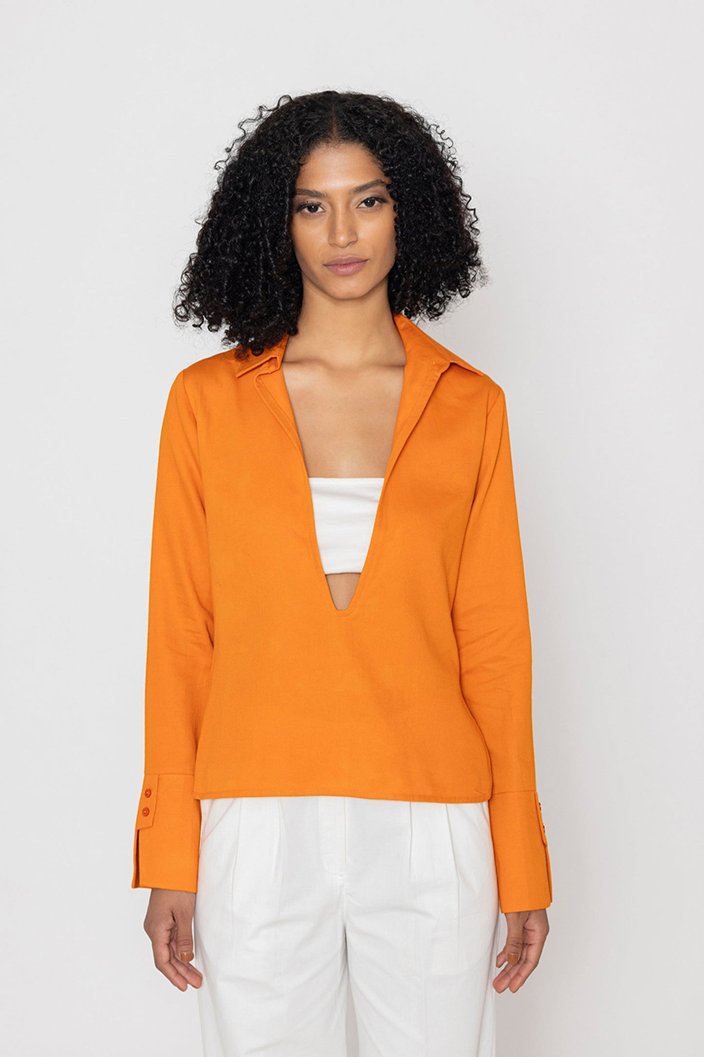 Stylera orange v-neck blouse for women with long sleeves and tailored cuffs