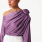 Stylera purple draped evening top with off-shoulder design and floral detail on shoulder