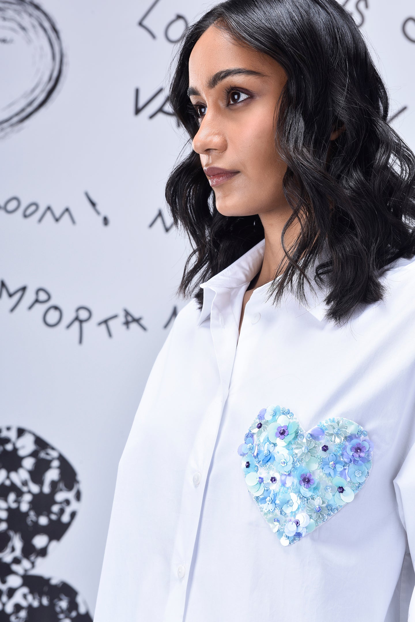 White Stylera sequin heart shirt with blue floral sequined heart detail