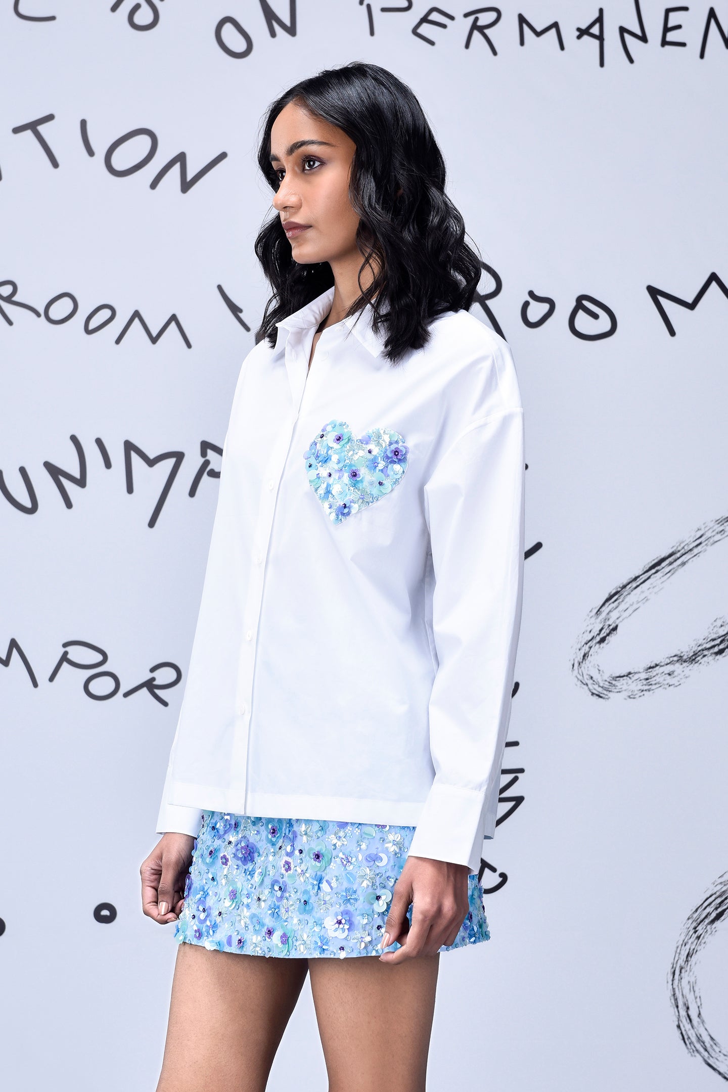 Stylera white sequin heart shirt with blue floral sequin heart detail on chest