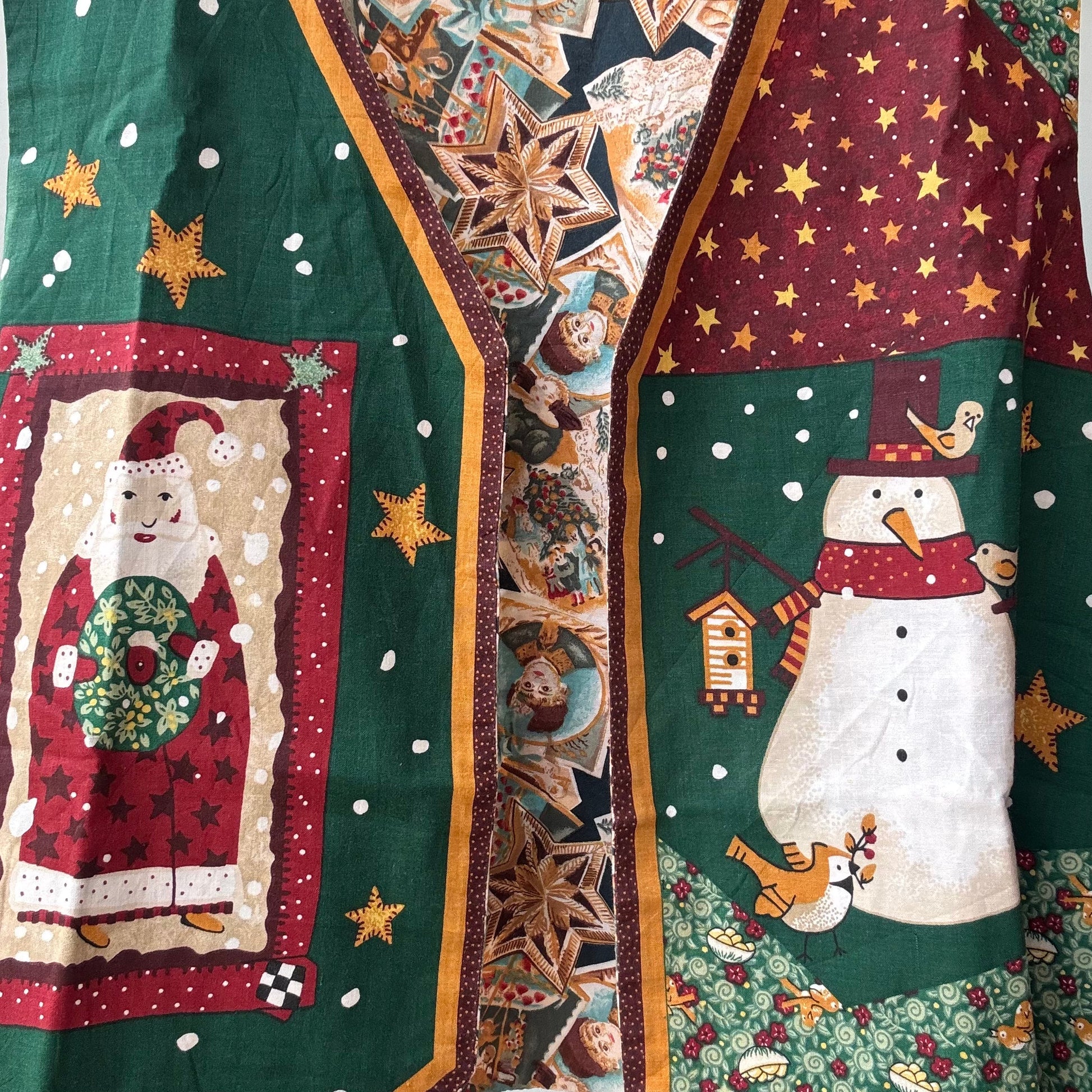 Christmas patchwork vest for women featuring Santa and snowman panels green and burgundy star quilted design