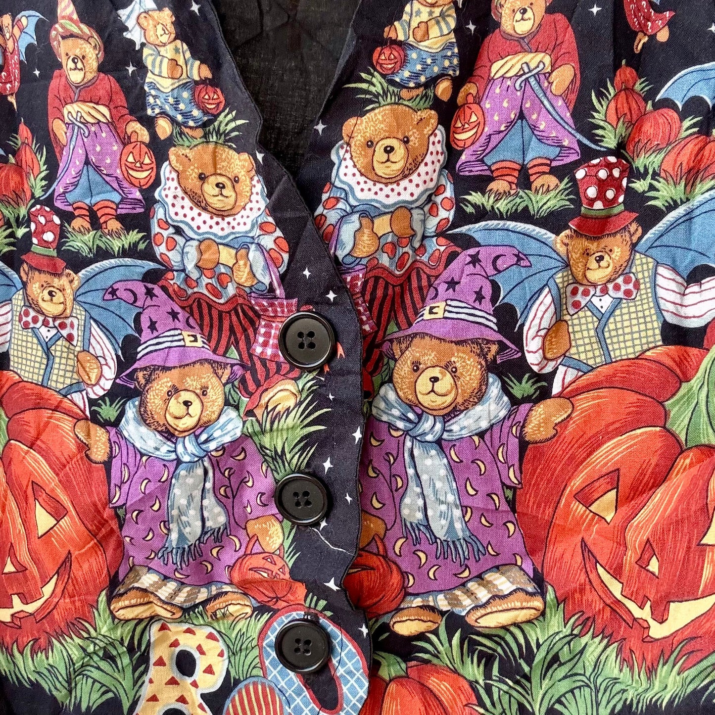 pumpkin halloween vest featuring whimsical teddy bear costume print with jack o lanterns and black buttons