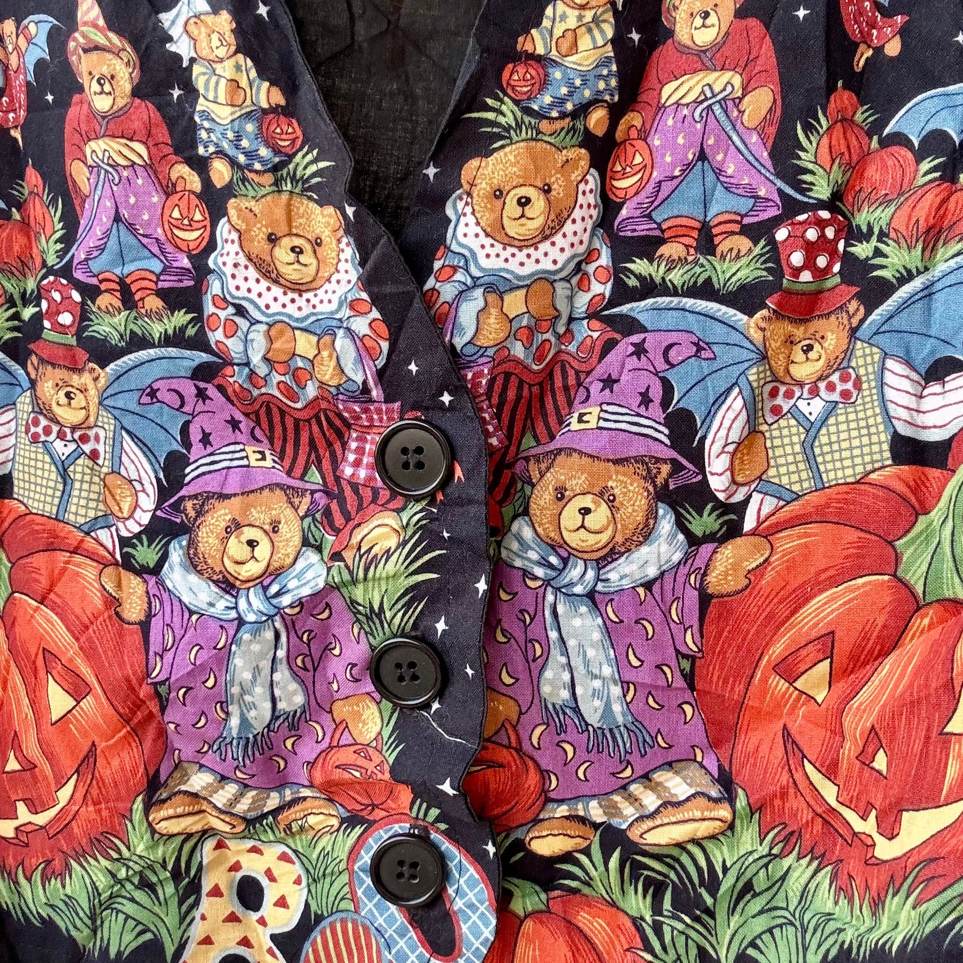 pumpkin halloween vest featuring whimsical teddy bear costume print with jack o lanterns and black buttons