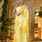 Elegant wedding organza saree yellow with floral designs, perfect for festive occasions and celebrations