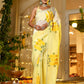Elegant wedding organza saree yellow with floral design worn by a model in a festive setting
