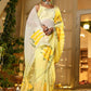 Elegant wedding organza saree yellow with floral designs draped gracefully for special occasions