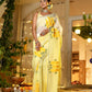 Elegant wedding organza saree yellow with floral print, perfect for festive occasions and celebrations