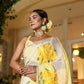 Elegant wedding organza saree yellow with floral patterns, styled for a festive occasion