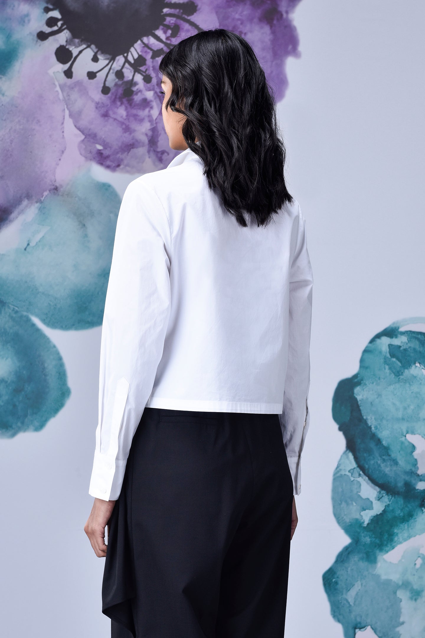 Stylera white cotton lace up shirt back view on model with long sleeves and cropped boxy fit