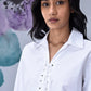 Stylera white cotton lace up shirt with eyelet front and classic collar on model