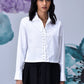 Stylera model wearing white cotton lace up shirt with collared neckline long sleeves and cropped hem