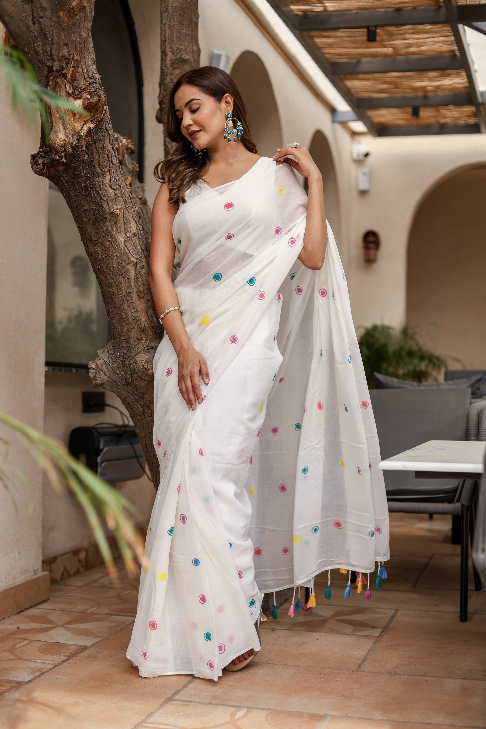 Stylera White Cotton Saree with Tassels adorned with colorful pom-poms for a vibrant look