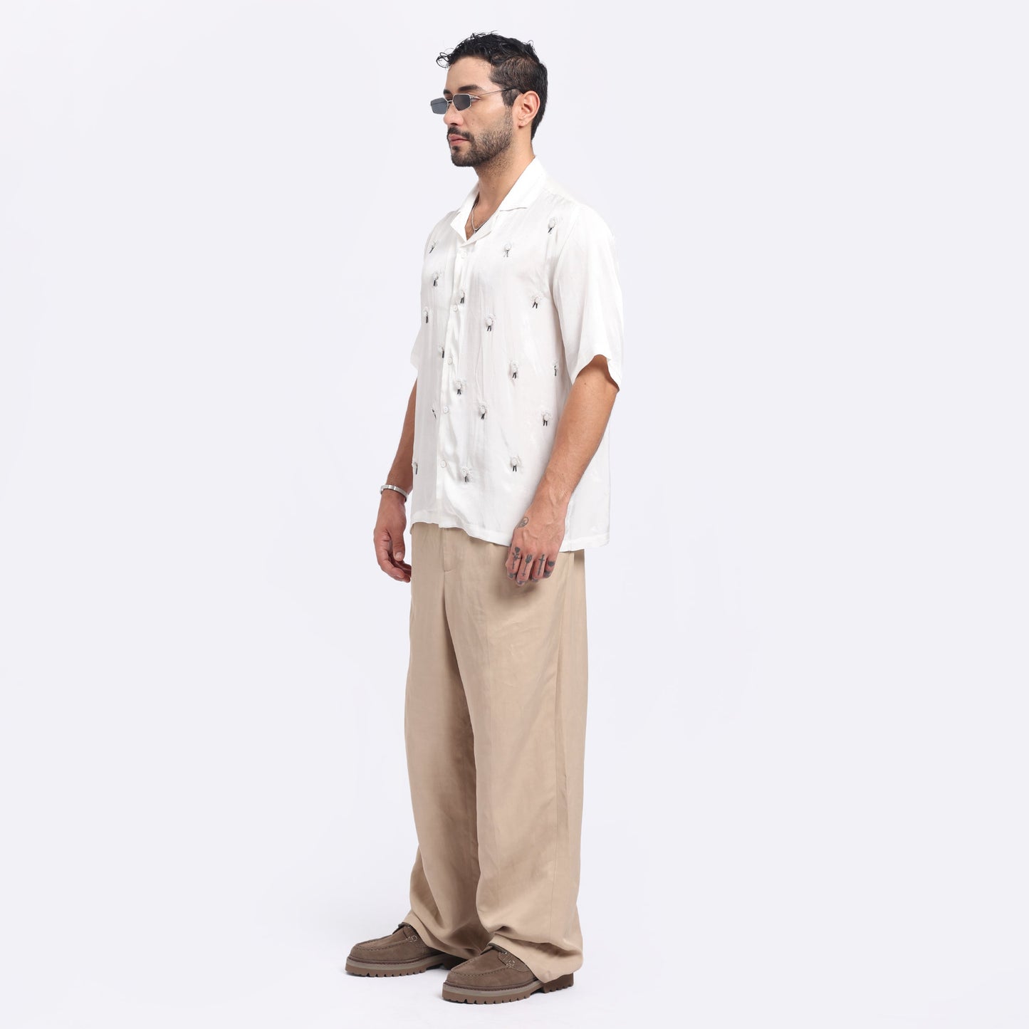 Stylera white embroidered casual shirt with a relaxed fit and floral patterns, perfect for laid-back occasions