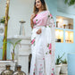 Elegant white floral saree for women with pink accents, perfect for festive occasions and celebrations