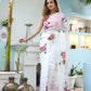 Elegant white floral saree for women featuring pink blooms, perfect for festive occasions