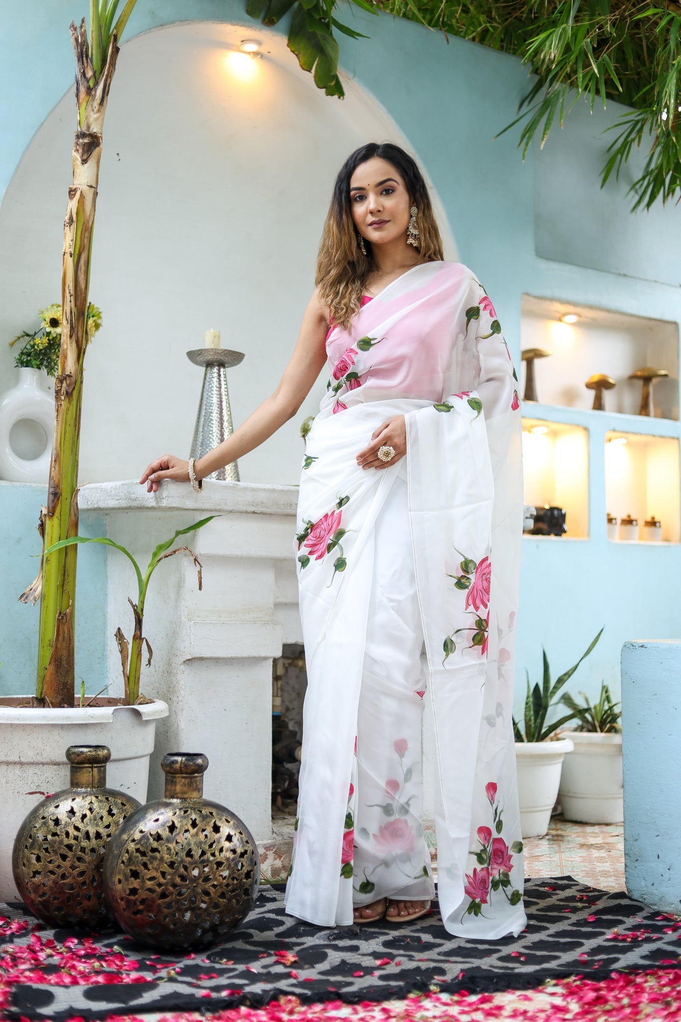 Elegant white floral saree for women featuring pink blooms, perfect for festive occasions