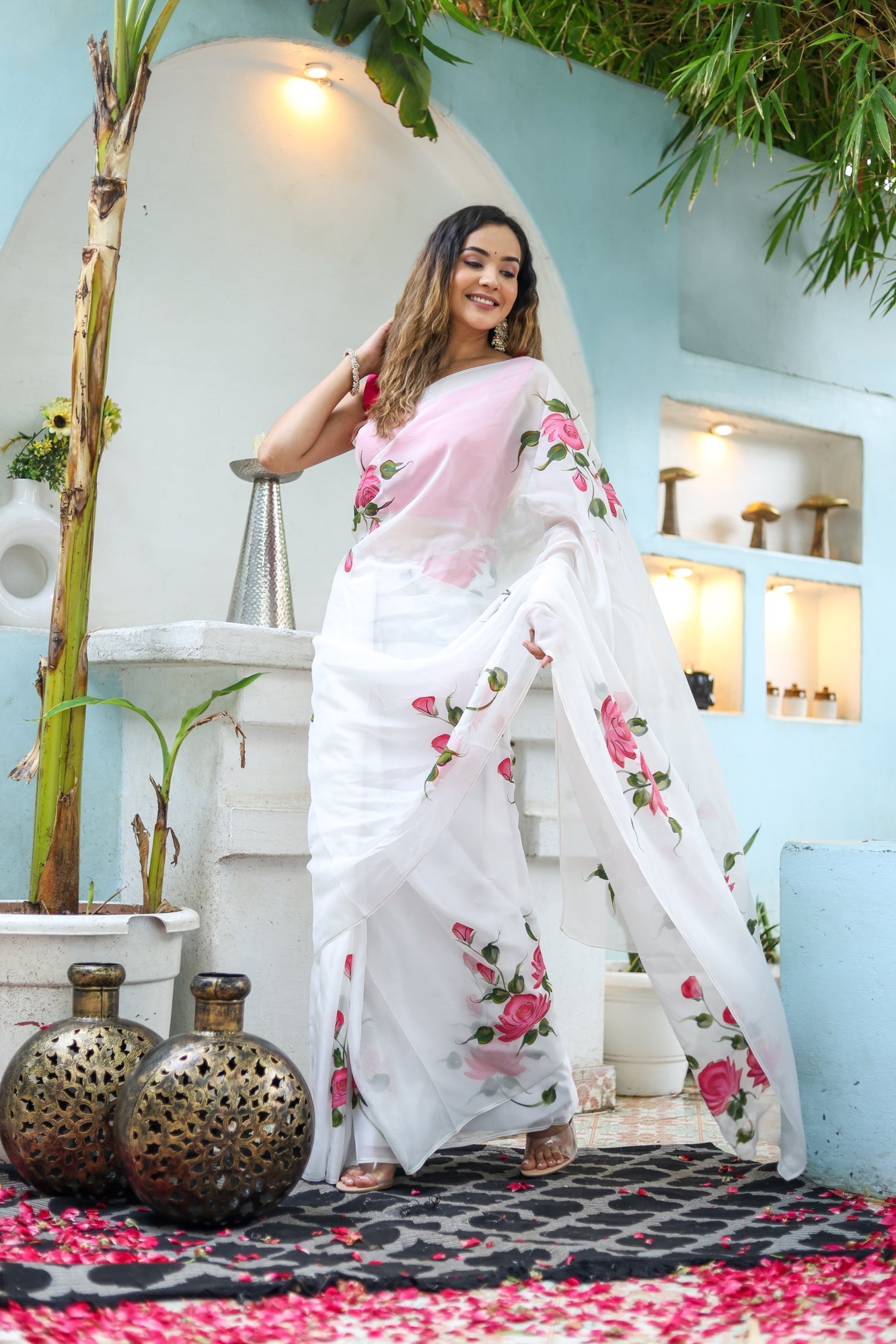 Elegant white floral saree for women featuring pink rose embroidery, perfect for special occasions