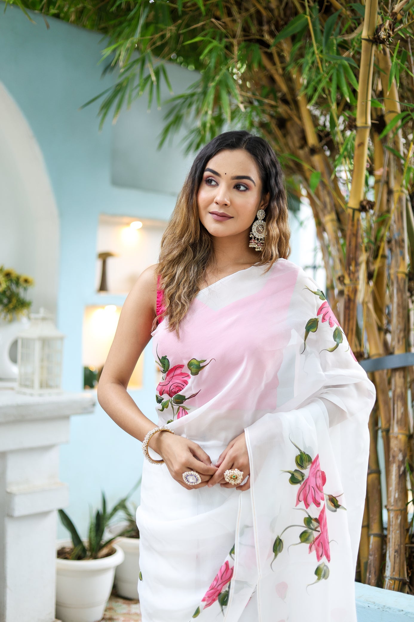 Elegant white floral saree for women with pink floral design, perfect for festive occasions