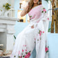 Elegant white floral saree for women featuring pink roses, perfect for festive occasions.