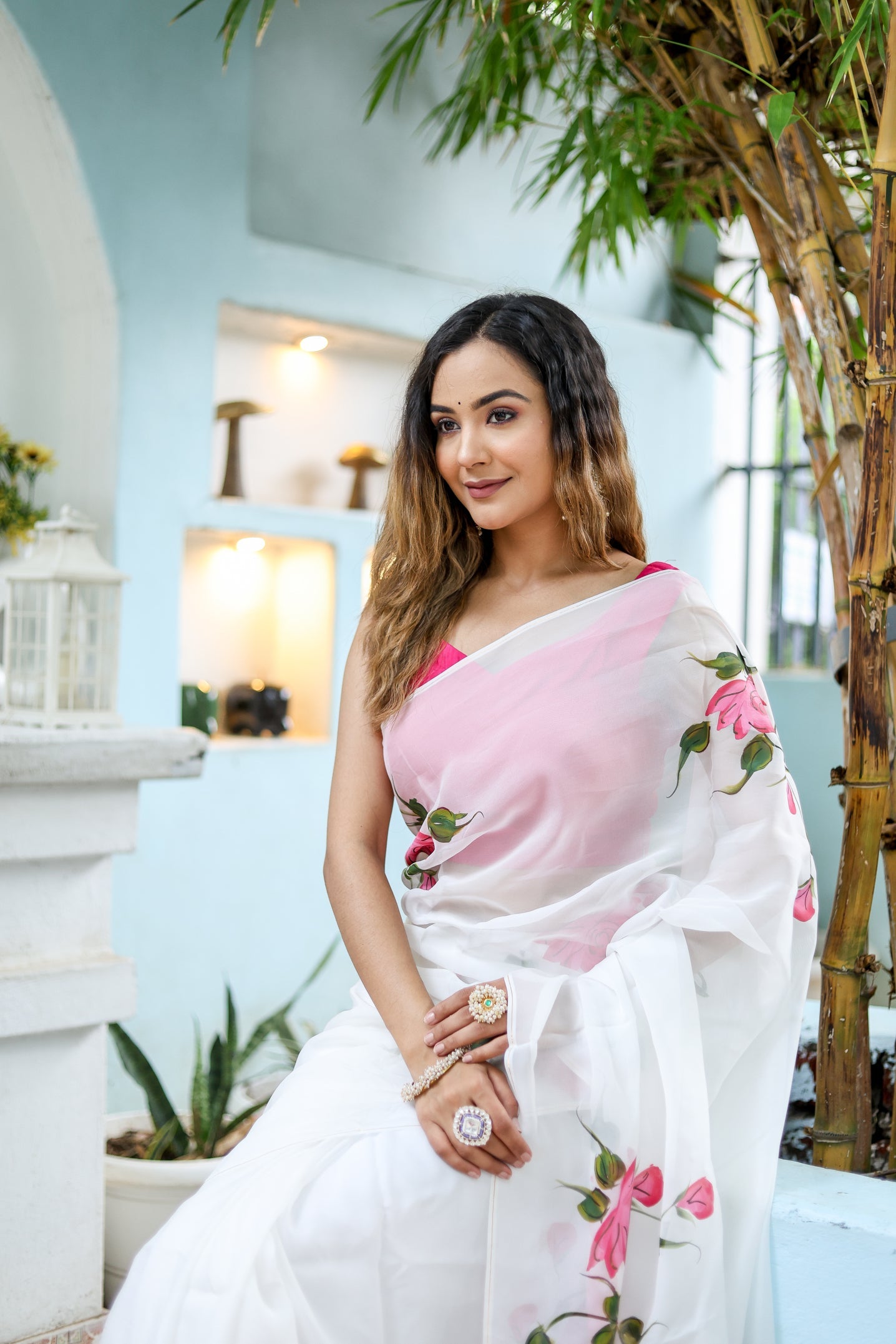 Elegant white floral saree for women with delicate pink rose embroidery, perfect for special occasions.