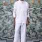 Stylera model wearing a white linen casual shirt for men with mandarin collar and chest pocket