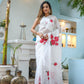 Elegant white organza saree for women featuring vibrant floral prints and graceful draping style