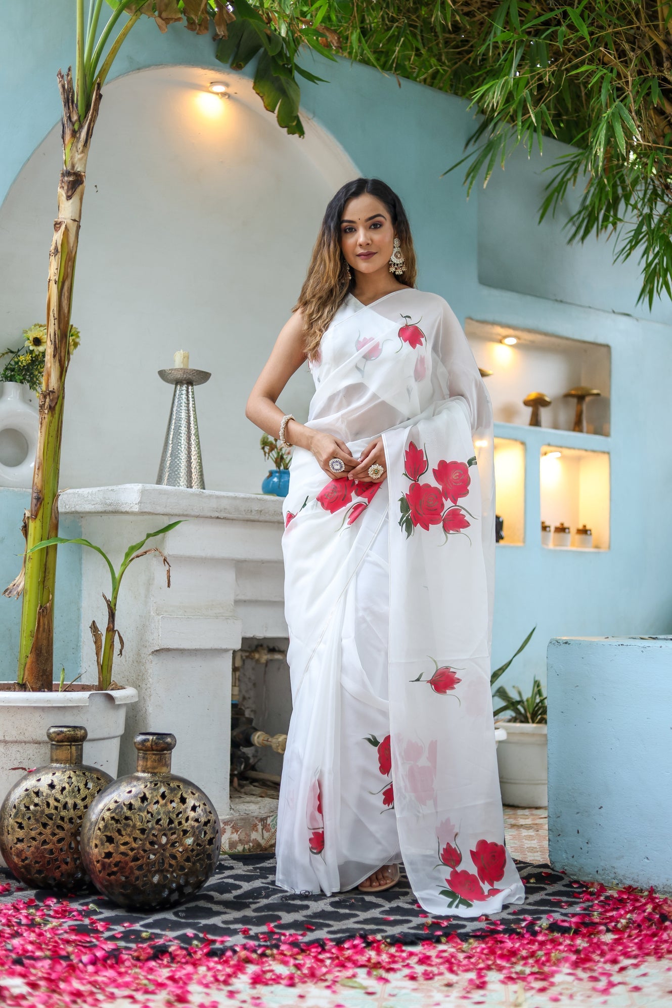 Elegant white organza saree for women featuring vibrant floral prints and graceful draping style