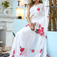 Elegant white organza saree for women featuring vibrant floral print and lightweight fabric