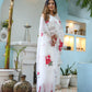 Elegant white organza saree for women adorned with floral designs, perfect for festive occasions