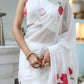 Elegant white organza saree for women with colorful floral prints, perfect for festive occasions