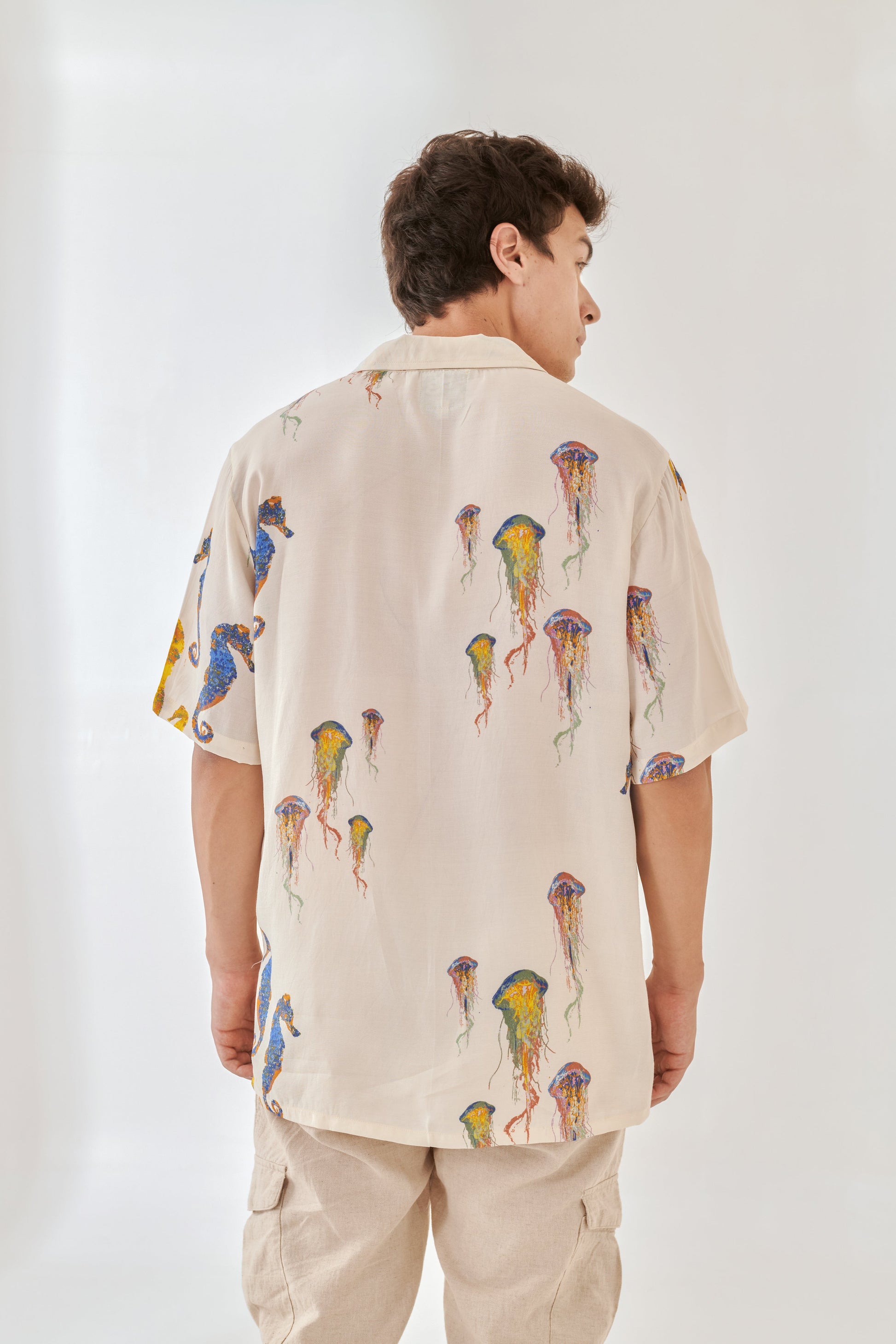 White oversized beach shirt men featuring colorful jellyfish print on a light background.