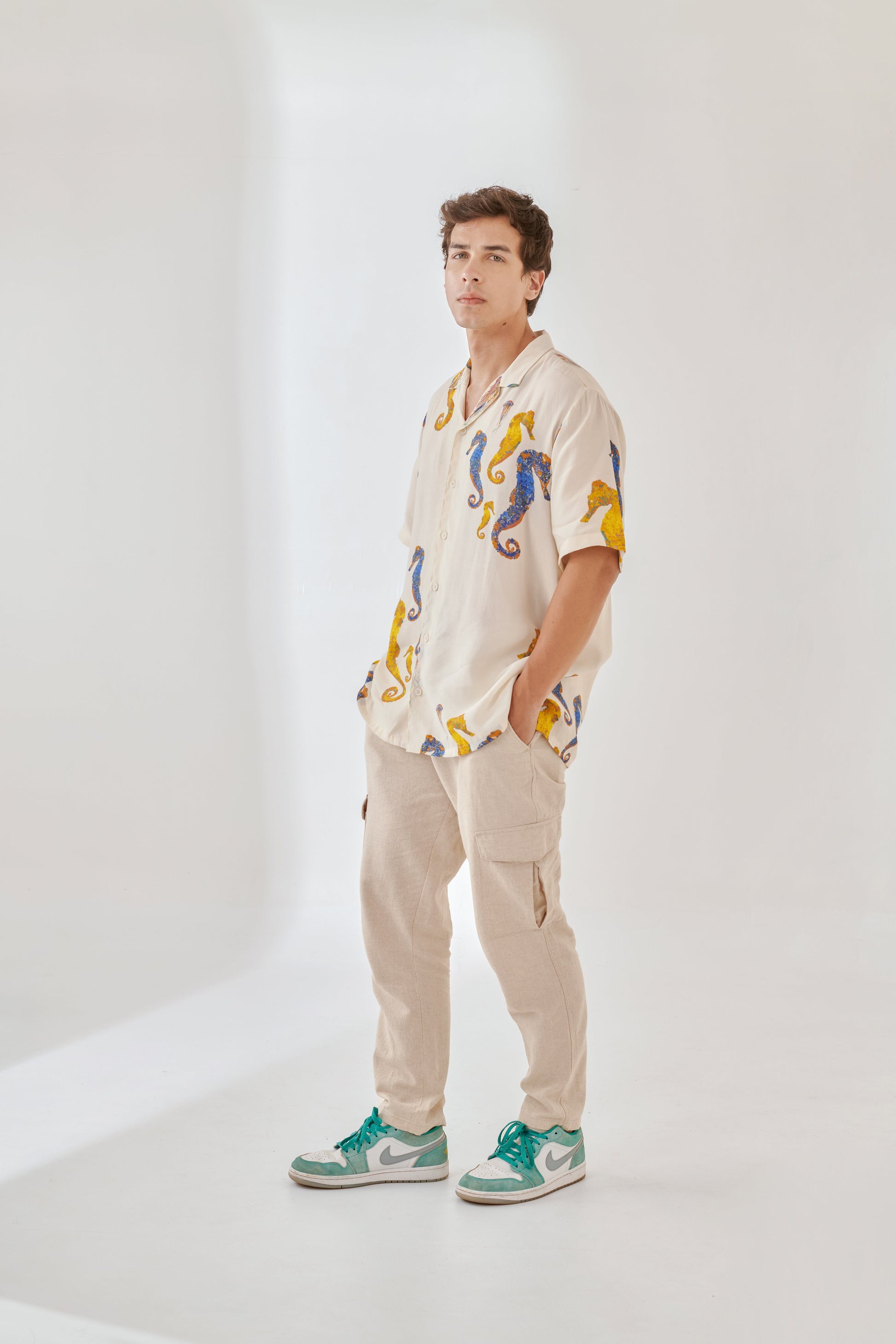 White oversized beach shirt men featuring colorful seahorse design, perfect for casual summer outings.