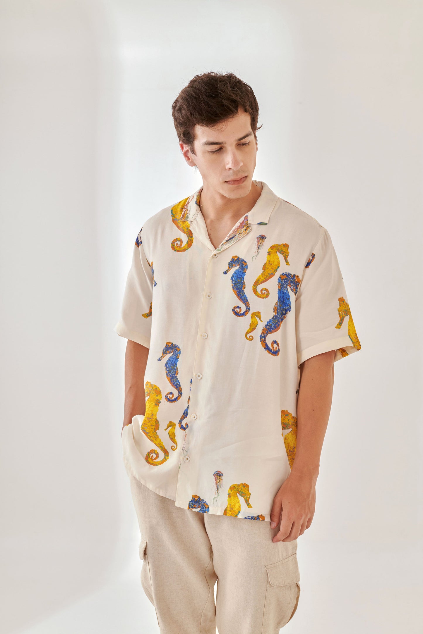 White oversized beach shirt men featuring colorful seahorse prints for a relaxed summer style