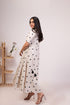 Elegant white polka dot dress for women with short sleeves and a flowy silhouette