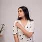 Elegant white polka dot dress for women with short sleeves and a flowy design
