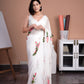 Elegant white saree with pink floral print, perfect for special occasions and celebrations