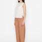white sleeveless blouse paired with brown wide-leg pants and brown flats