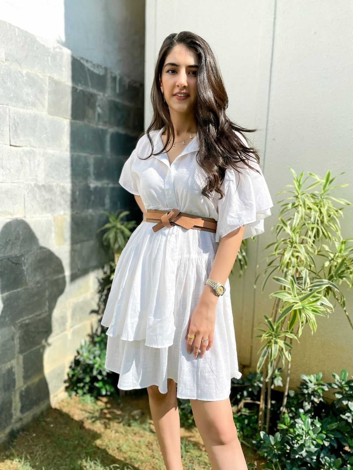 Chic white summer dress for women with ruffled sleeves and a stylish belt for a trendy look