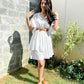 Stylish white summer dress for women by Stylera, featuring a belt and elegant sleeve design