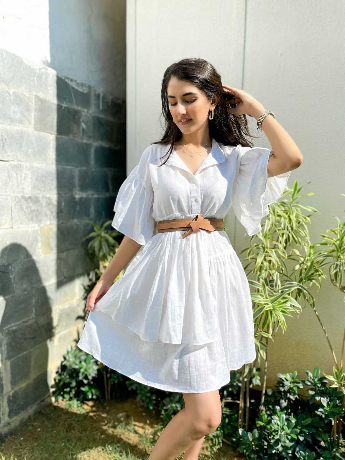 Stylish white summer dress for women with puff sleeves and a belted waist, perfect for warm weather