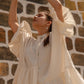 Elegant white summer dress for women with puffy sleeves and a relaxed fit, perfect for sunny days